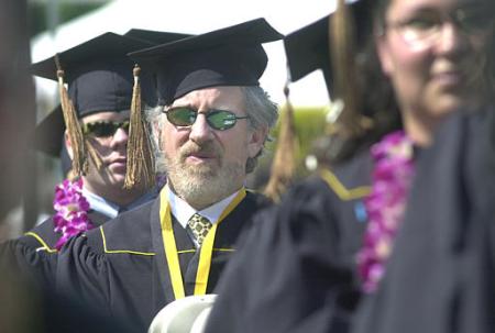 $2 billion Steven Spielberg sits among fellow graduates during commencement ceremonies, California State University, Long Beach, May 31, 2002.